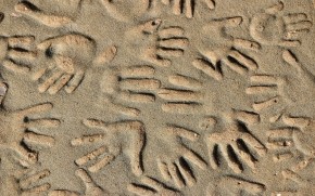 Handprints in the Sand wallpaper