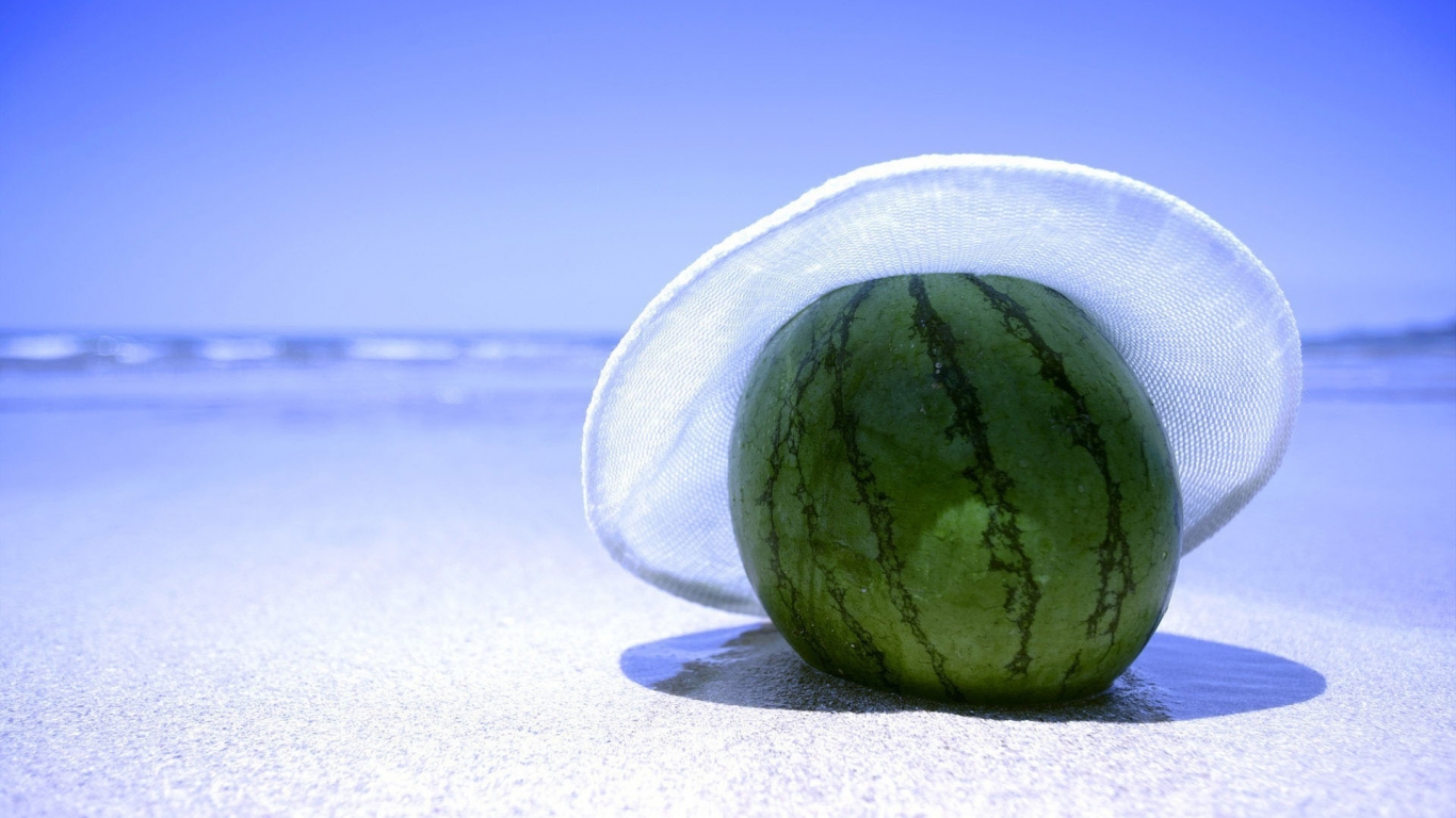 Watermelon on the beach for 1366 x 768 HDTV resolution