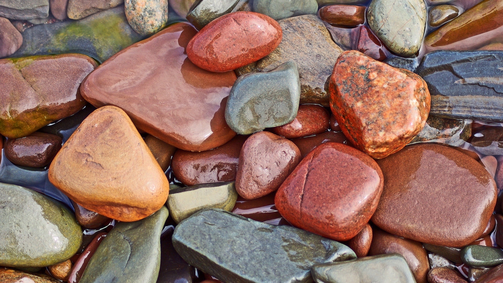 Wet colourful rocks for 1680 x 945 HDTV resolution